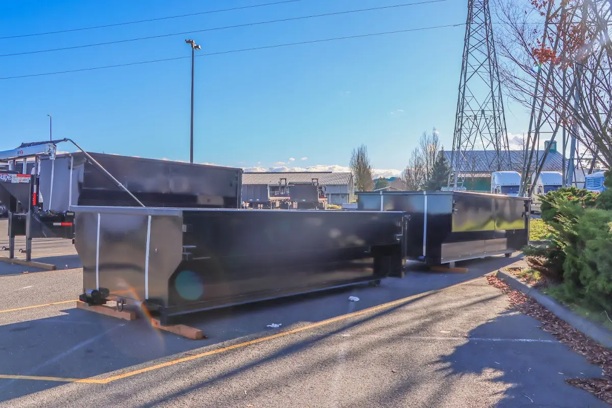 Roll-off dumpster ready for waste disposal at job site for Concrete Dumpster Rental in Dumas